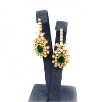Ladies 14k Yellow Gold Earrings with emerald stone in center 